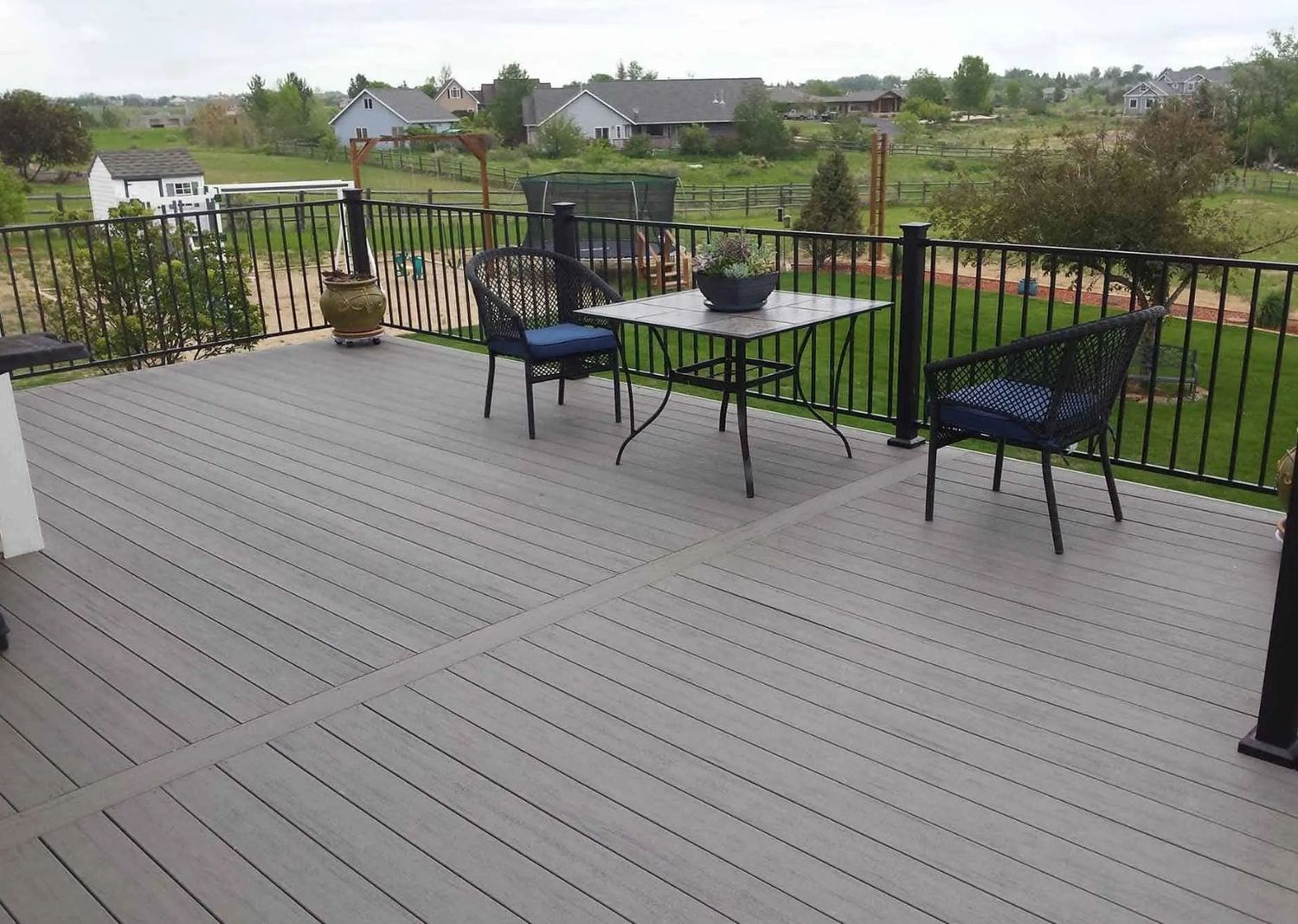 Composite deck surface with patio furniture