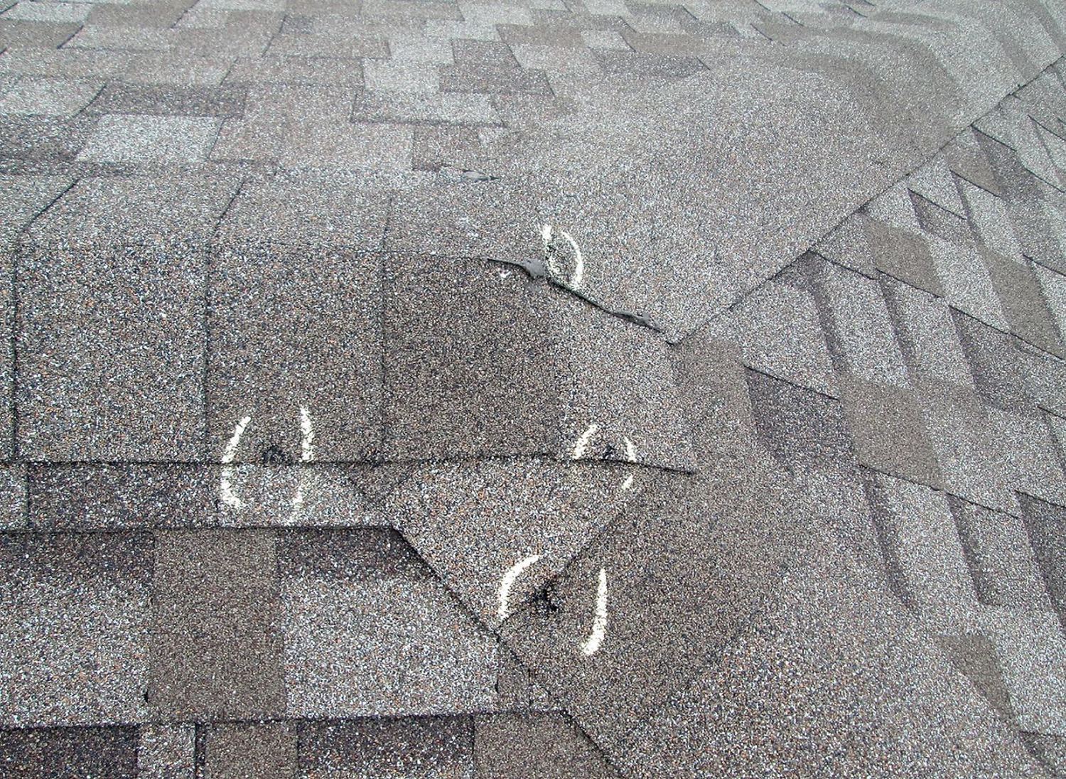Shingle damage on a roof after a hail storm