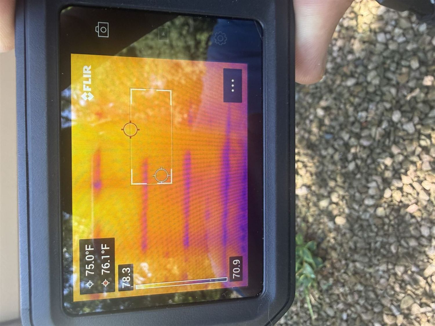 Thermal imaging camera reading a wall for hidden moisture