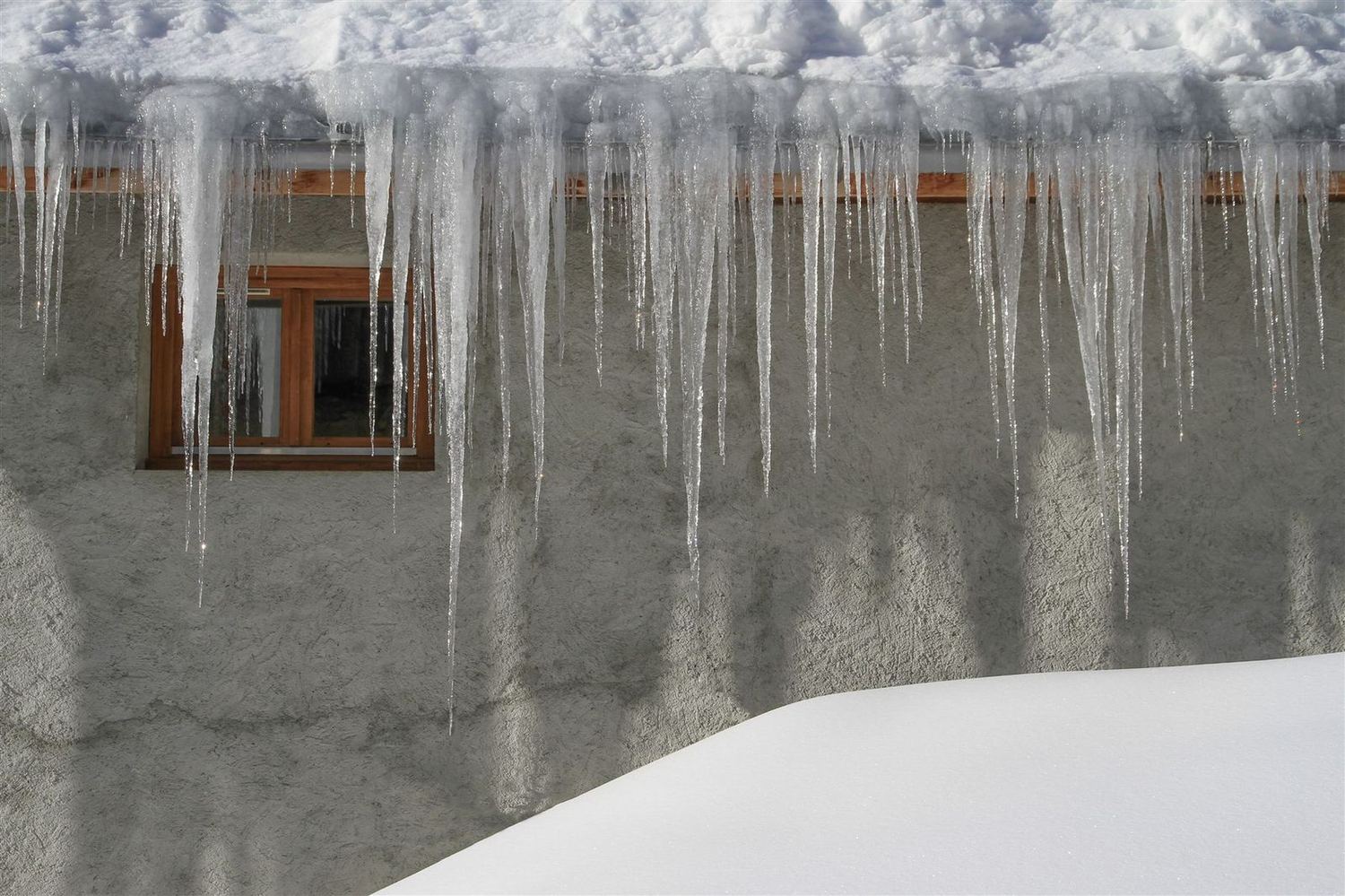 Condensation and ice on the inside of a window in winter